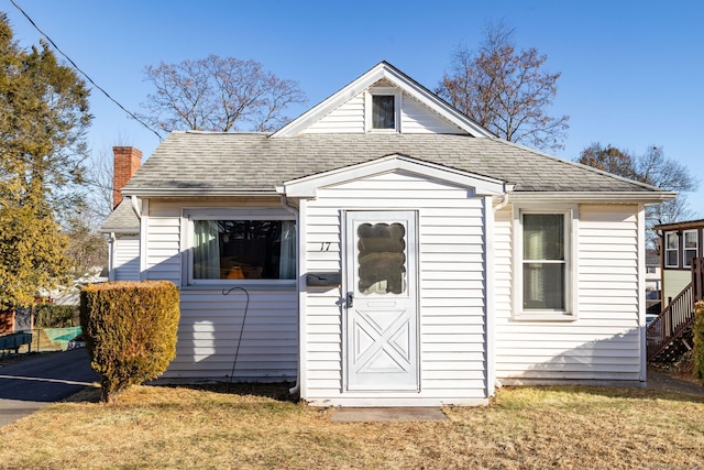 view of outbuilding featuring a yard