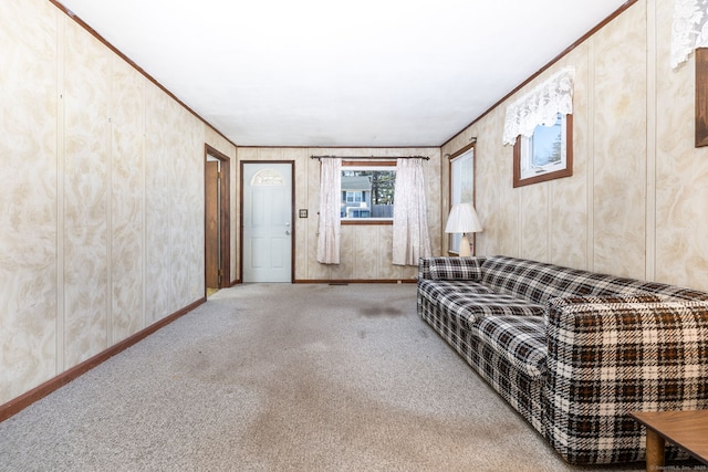 unfurnished living room featuring carpet and ornamental molding