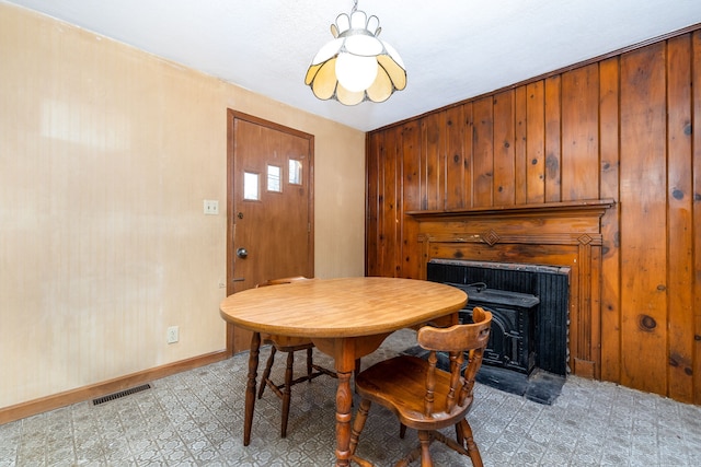 dining area with wooden walls