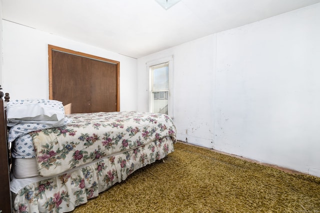 carpeted bedroom featuring a closet