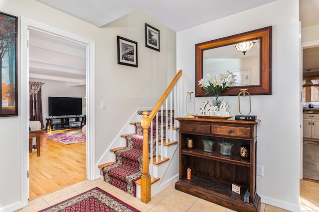 staircase with tile patterned floors