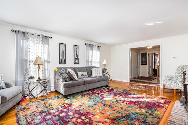 living room with crown molding and hardwood / wood-style floors