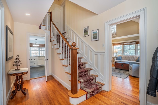 staircase with hardwood / wood-style flooring and a wealth of natural light