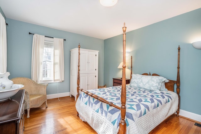 bedroom with wood-type flooring