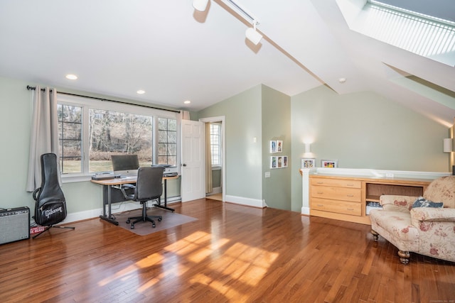 office space featuring hardwood / wood-style floors and vaulted ceiling