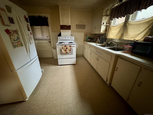 kitchen featuring white appliances and sink