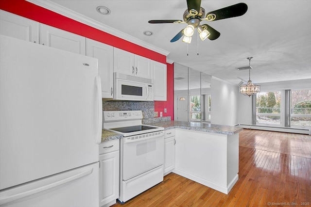 kitchen with white cabinetry, white appliances, kitchen peninsula, and a baseboard heating unit