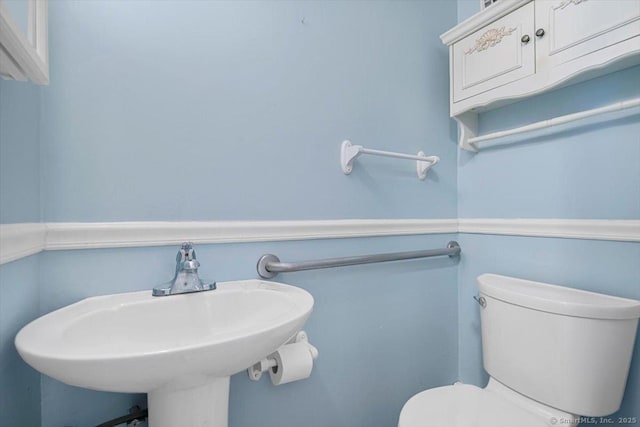 bathroom with toilet and sink