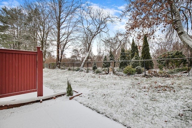 view of yard layered in snow