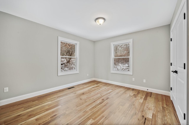 spare room with light hardwood / wood-style floors