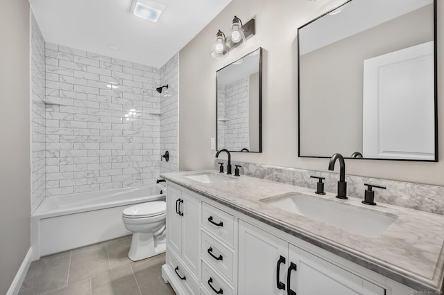 full bathroom featuring toilet, tiled shower / bath combo, tile patterned floors, and vanity