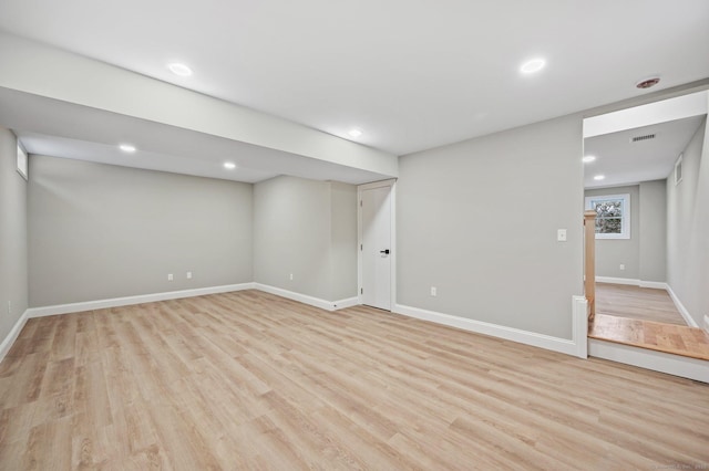 basement featuring light hardwood / wood-style flooring