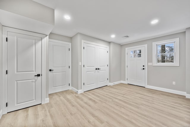 entrance foyer with light hardwood / wood-style flooring