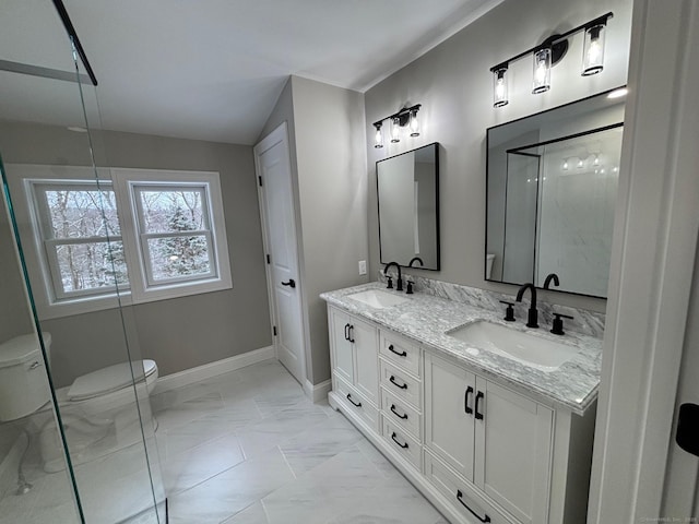 bathroom featuring toilet, a shower with door, and vanity