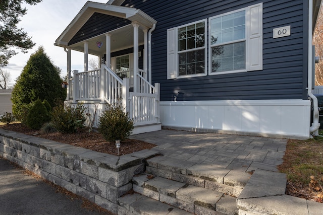 doorway to property featuring a porch