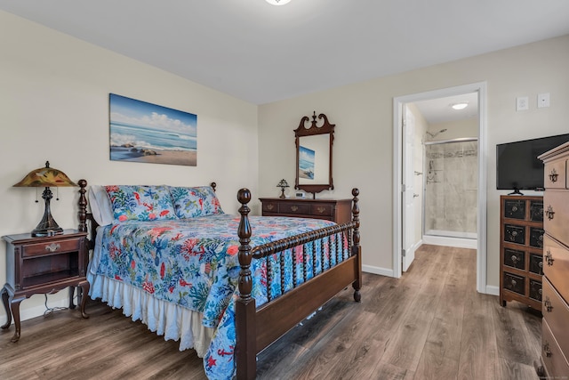 bedroom featuring wood-type flooring and ensuite bathroom