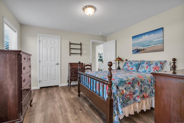 bedroom with hardwood / wood-style flooring