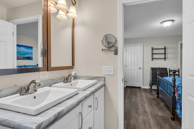 bathroom with vanity and wood-type flooring