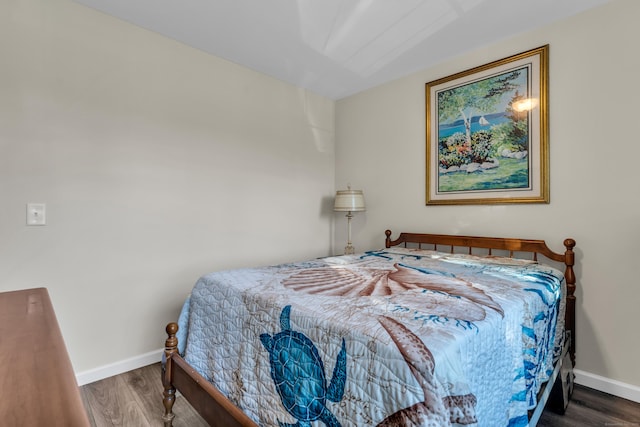 bedroom featuring dark hardwood / wood-style flooring