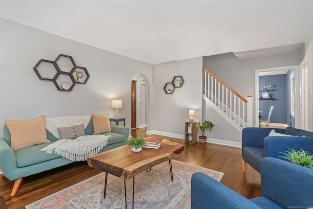 living room with dark hardwood / wood-style floors