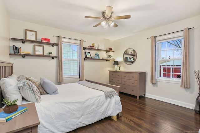 bedroom with dark hardwood / wood-style flooring and ceiling fan