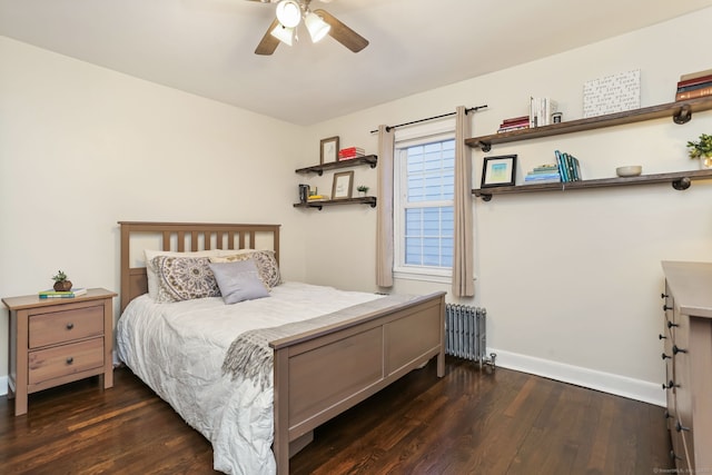 bedroom with ceiling fan, radiator heating unit, and dark hardwood / wood-style floors