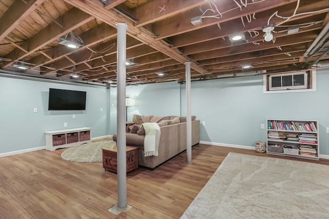 basement featuring hardwood / wood-style floors