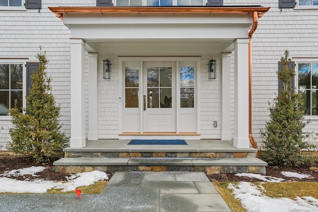 view of snow covered property entrance