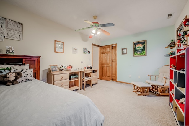 bedroom featuring light colored carpet and ceiling fan