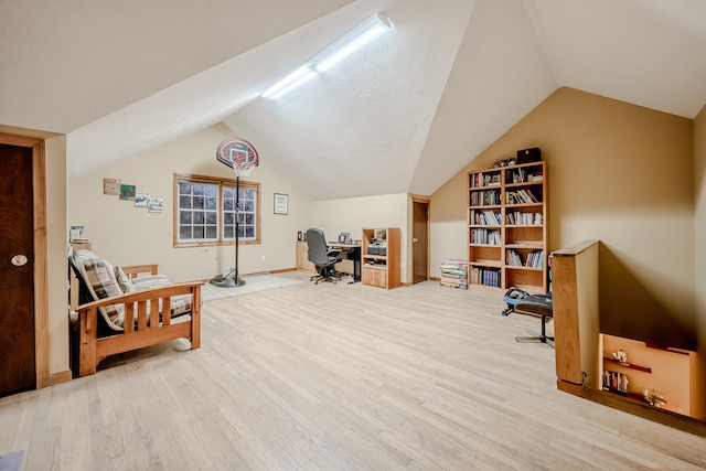 office featuring hardwood / wood-style flooring and lofted ceiling