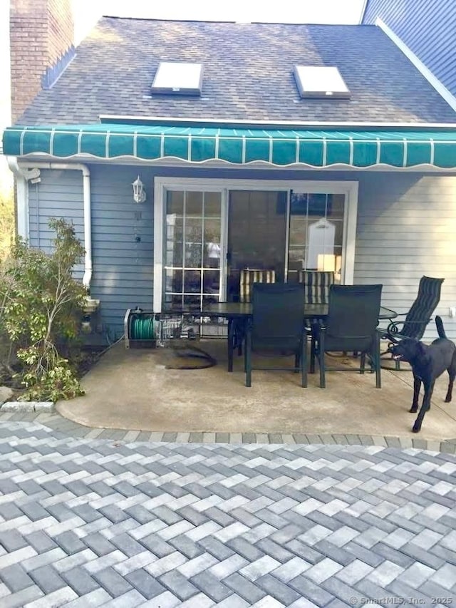 rear view of house with a patio