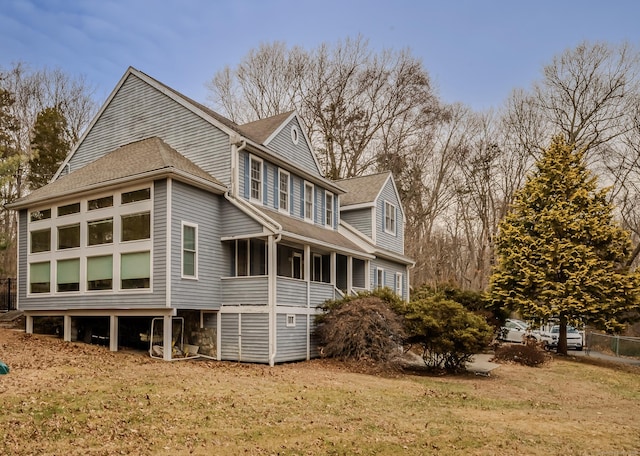 view of side of home featuring a lawn