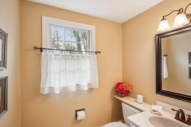 bathroom featuring toilet and sink