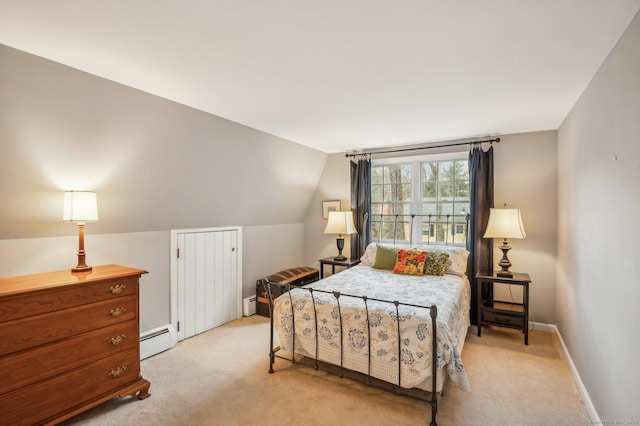 bedroom with light colored carpet, vaulted ceiling, and a baseboard heating unit