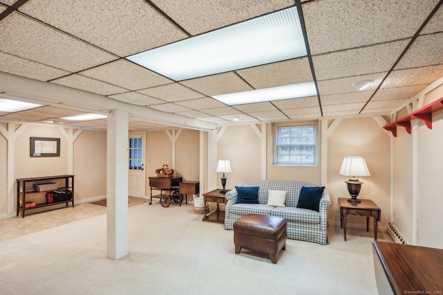 carpeted living room featuring baseboard heating