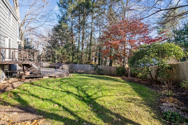 view of yard featuring a wooden deck