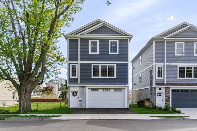 view of front of property with a garage