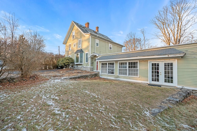 rear view of house featuring french doors