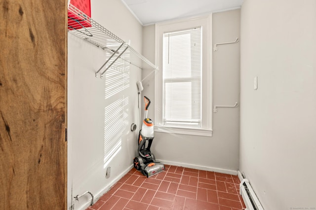 laundry room with a baseboard radiator