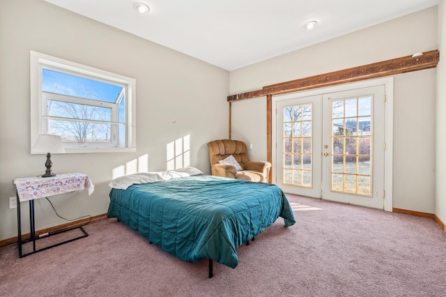 bedroom with light colored carpet, access to outside, and french doors