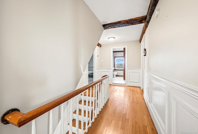 hallway with light hardwood / wood-style floors