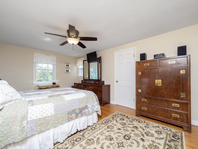 bedroom featuring ceiling fan and light hardwood / wood-style flooring