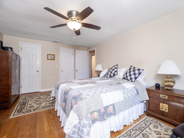 bedroom featuring ceiling fan and wood-type flooring