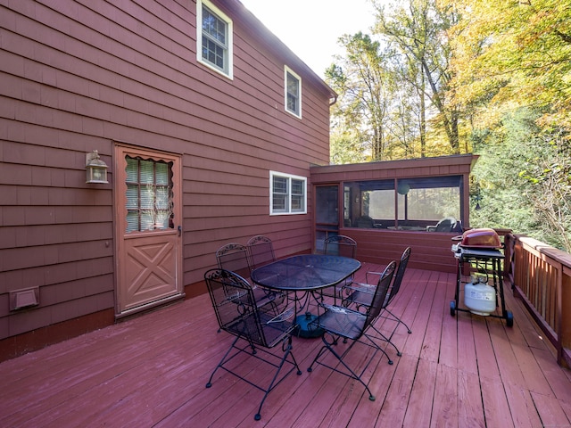 wooden terrace with a sunroom