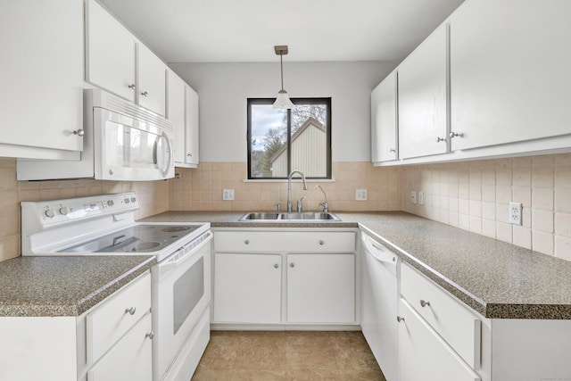 kitchen featuring white cabinets, white appliances, tasteful backsplash, and sink