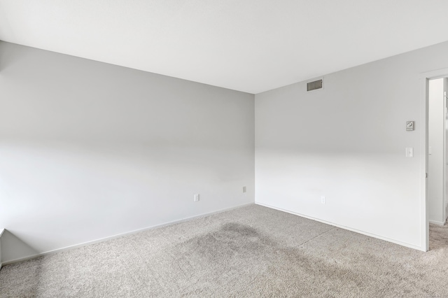 unfurnished room featuring carpet