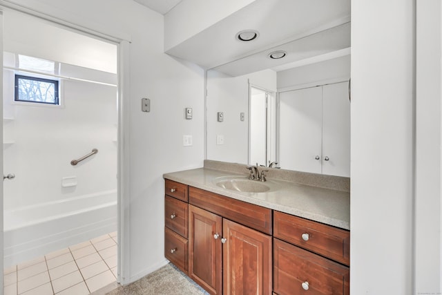 bathroom featuring tile patterned floors, vanity, and bathtub / shower combination