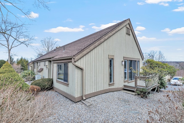 view of side of property featuring a deck