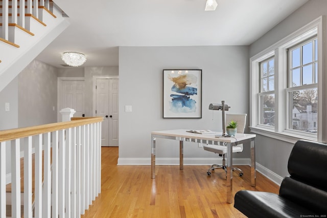 office area with light hardwood / wood-style floors