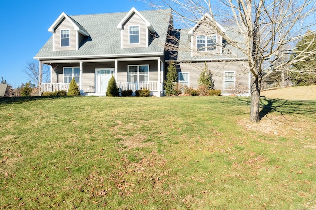 cape cod-style house with covered porch and a front yard